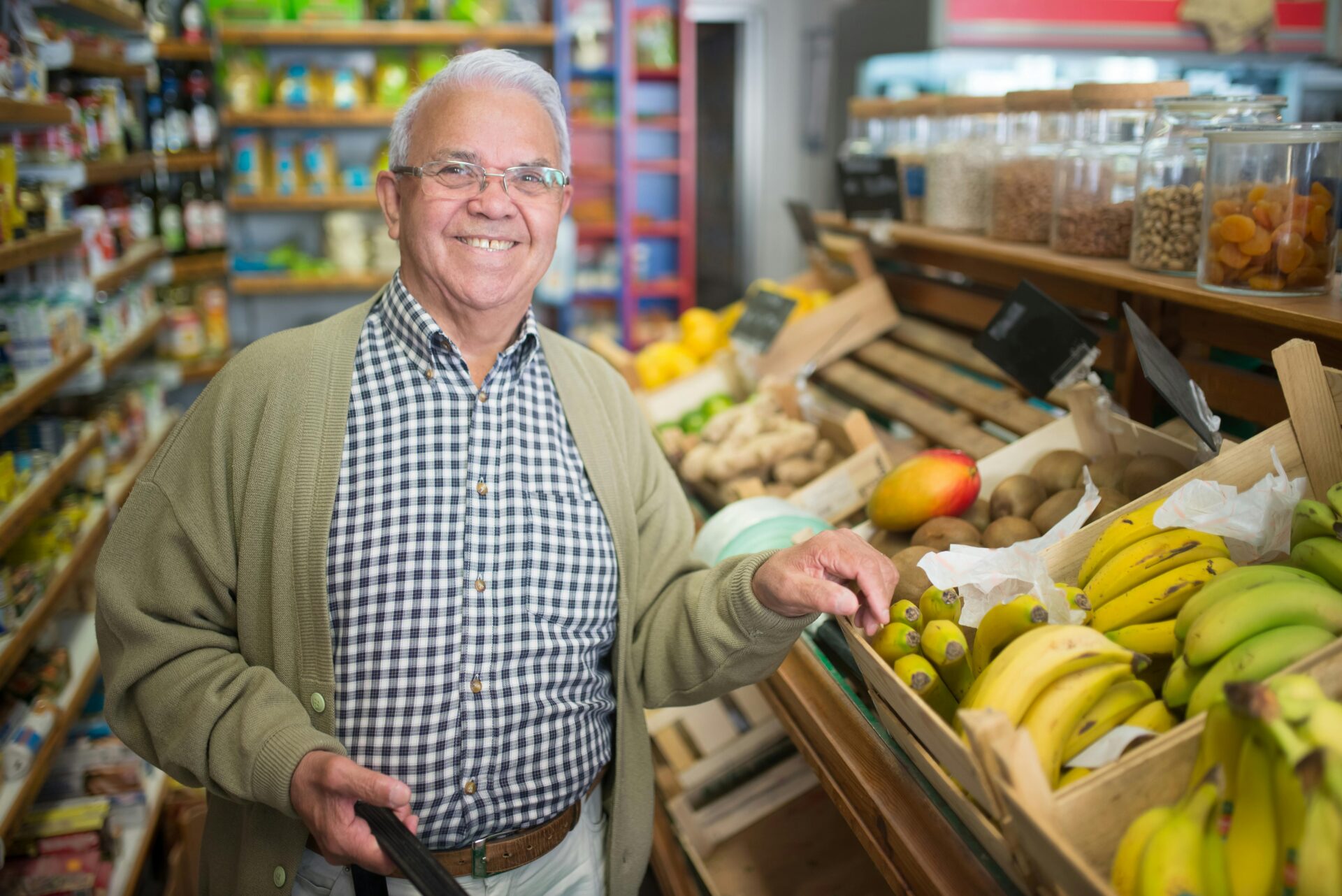 Retiring business owner in grocery setting during the silver tsunami small business wave